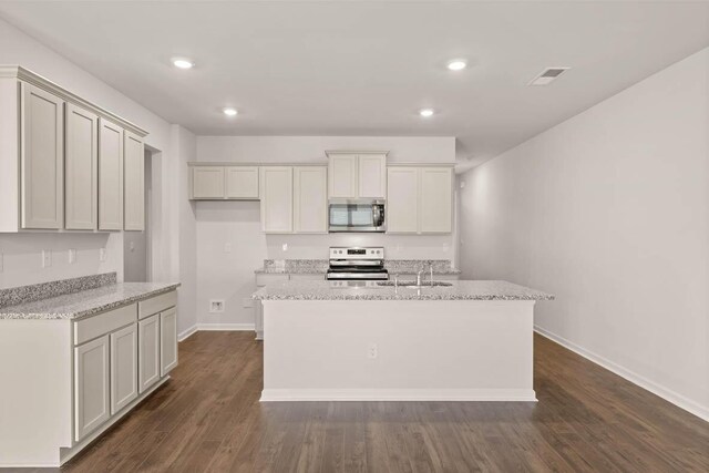 3447 Firestone Dr, Hephzibah, GA 30815 - kitchen with appliances with stainless steel finishes, a center island with sink, baseboards, dark wood-style flooring, and recessed lighting