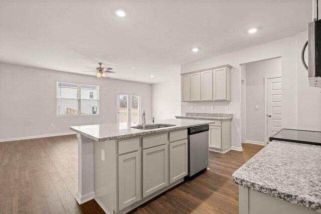 3447 Firestone Dr, Hephzibah, GA 30815 - kitchen with an island with sink, dark wood-style floors, a ceiling fan, a sink, and appliances with stainless steel finishes