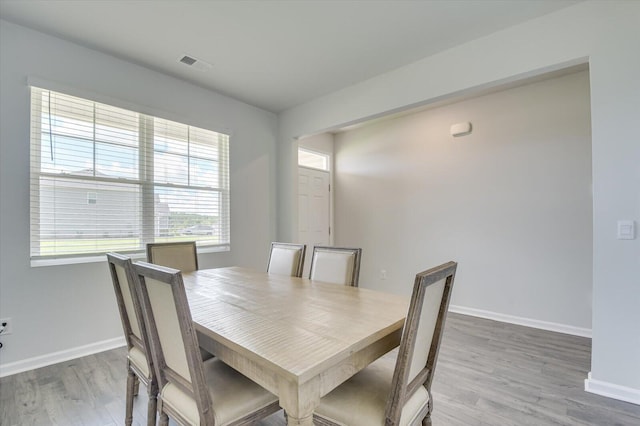 6093 Whitewater Dr, North Augusta, SC 29841 - dining room with light wood finished floors and baseboards