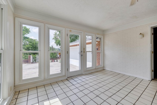 3009 Arcadia Ct, Augusta, GA 30906 - unfurnished sunroom with brick wall, french doors, a textured ceiling, and crown molding