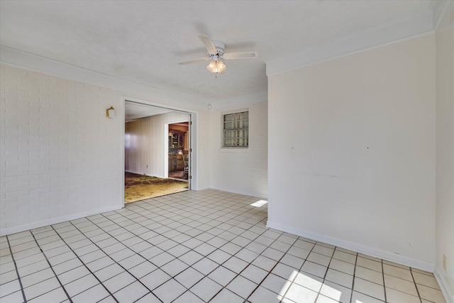 3009 Arcadia Ct, Augusta, GA 30906 - unfurnished room with a ceiling fan, brick wall, light tile patterned floors, ornamental molding, and baseboards