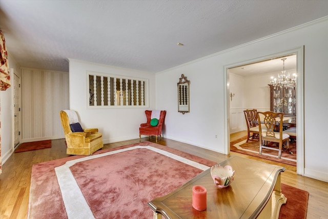 3009 Arcadia Ct, Augusta, GA 30906 - living room featuring ornamental molding, wood finished floors, a chandelier, and baseboards