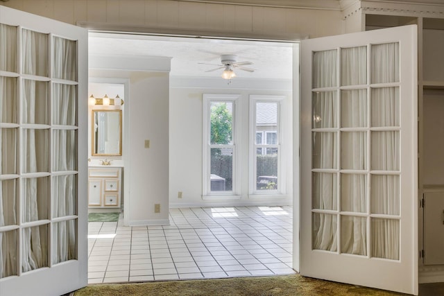 3009 Arcadia Ct, Augusta, GA 30906 - doorway with tile patterned floors, a ceiling fan, and baseboards