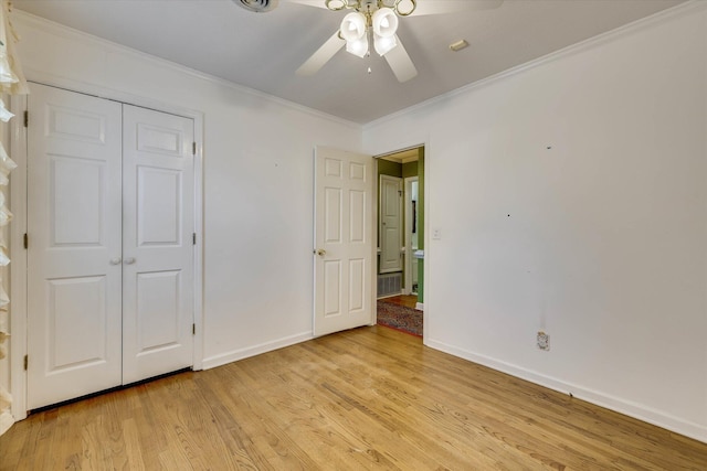 3009 Arcadia Ct, Augusta, GA 30906 - unfurnished bedroom with ornamental molding, light wood-style flooring, baseboards, a closet, and a ceiling fan