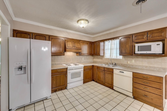 3009 Arcadia Ct, Augusta, GA 30906 - kitchen featuring white appliances, a sink, light countertops, decorative backsplash, and crown molding