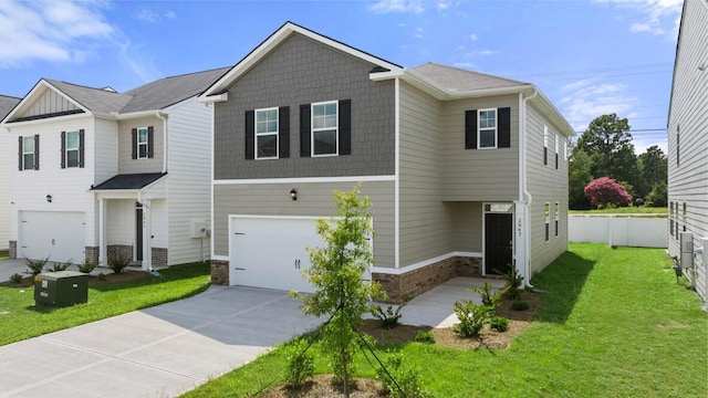 view of front of property featuring a garage, a front yard, driveway, and fence