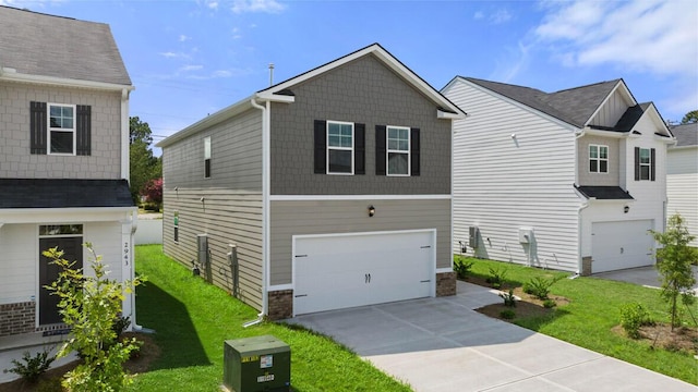 view of front of house with a front yard, driveway, and an attached garage