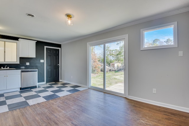 kitchen featuring visible vents, crown molding, light floors, white cabinetry, and stainless steel dishwasher