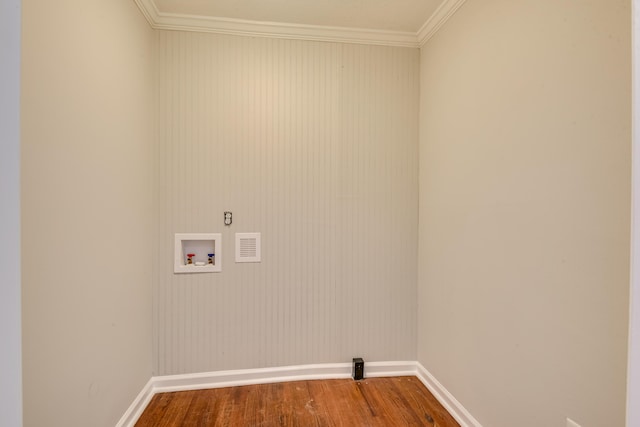 washroom with baseboards, laundry area, dark wood-style flooring, washer hookup, and crown molding