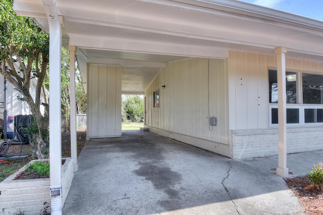 garage featuring a carport and driveway