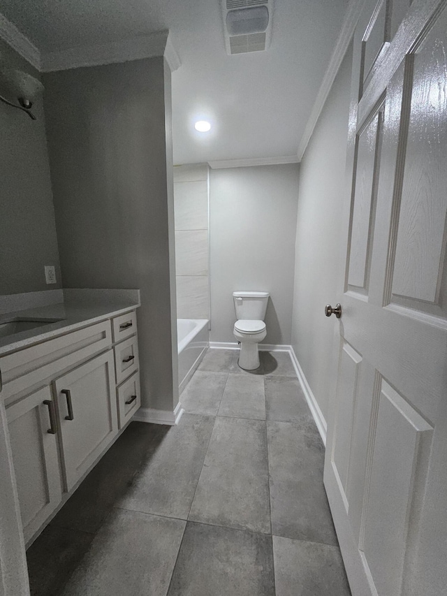 bathroom with toilet, visible vents, vanity, baseboards, and ornamental molding