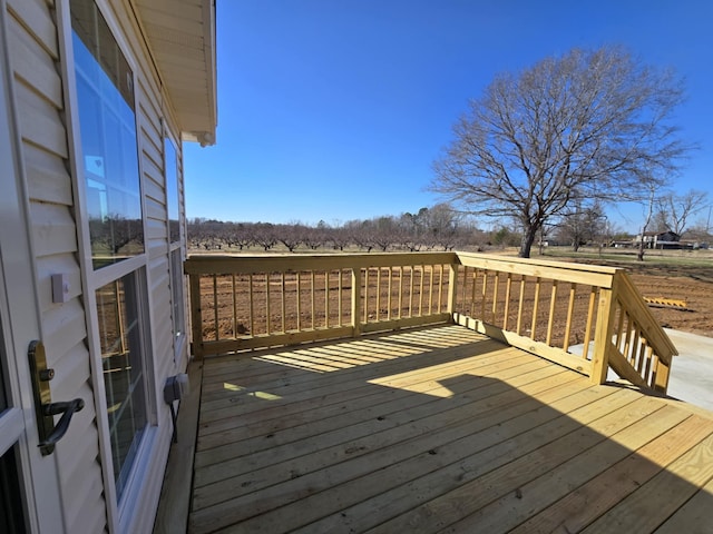 wooden terrace with a rural view