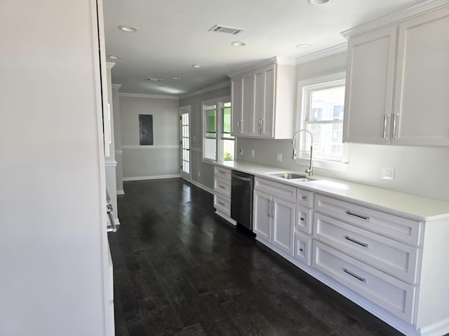 kitchen featuring visible vents, dark wood finished floors, ornamental molding, stainless steel dishwasher, and a sink