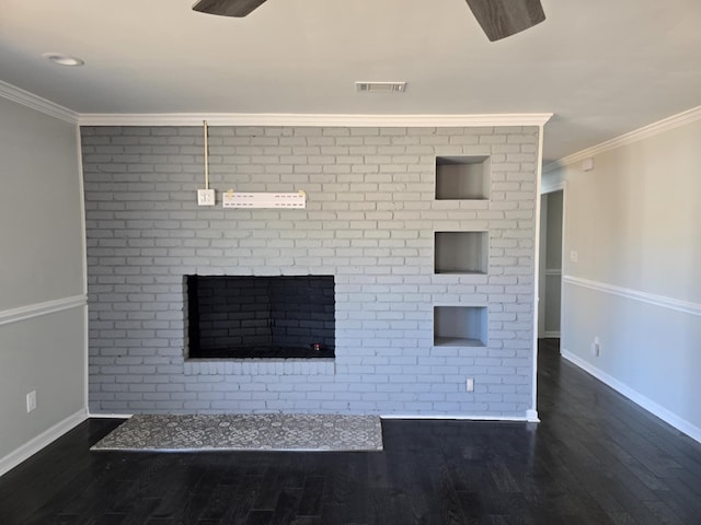 unfurnished living room with ornamental molding, wood finished floors, and visible vents