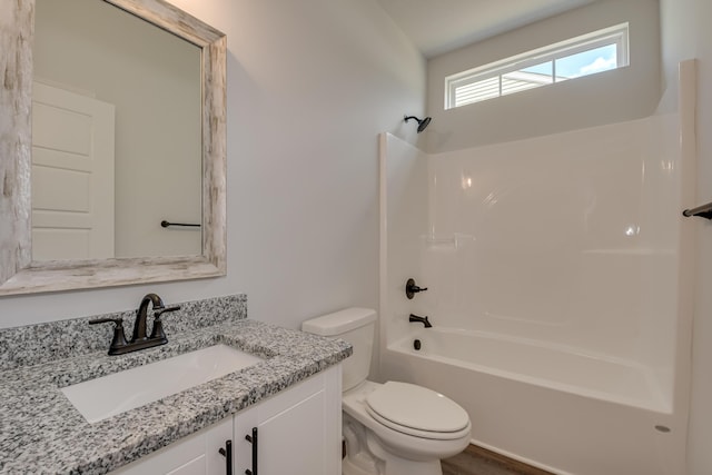 full bath featuring toilet,  shower combination, and vanity