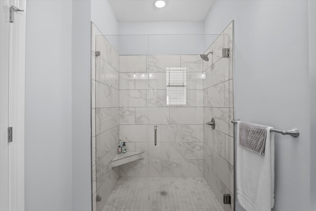 bathroom with a shower with shower door