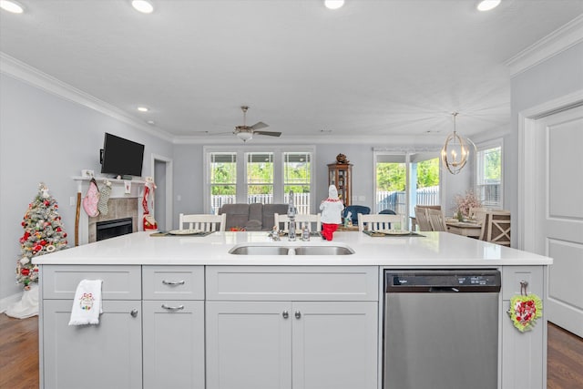 kitchen with white cabinetry, dishwasher, an island with sink, and sink