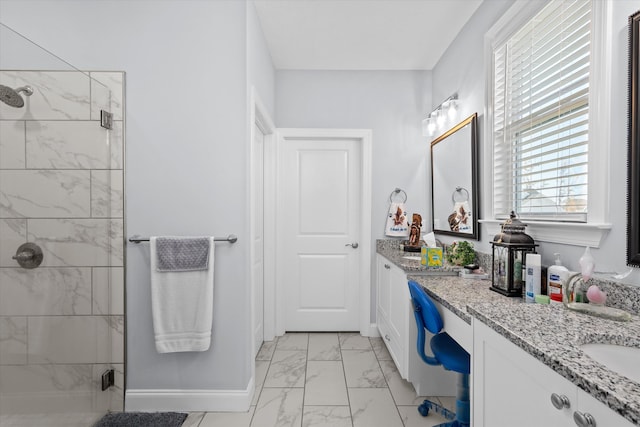 bathroom featuring vanity and a shower with door