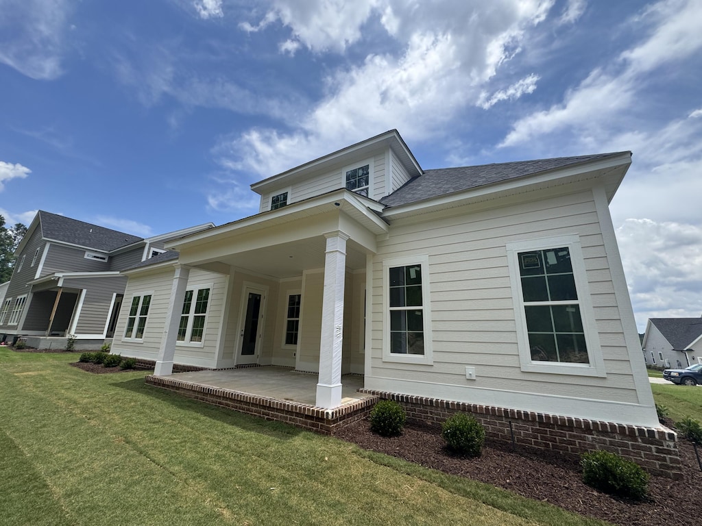 640 River Oaks Ln, Evans, GA 30809 - rear view of property featuring a patio area, a lawn, and a shingled roof