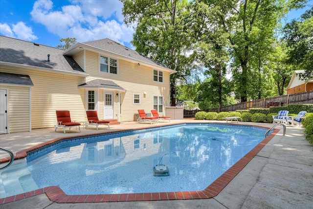 view of pool with a patio area, a fenced backyard, a diving board, and a fenced in pool