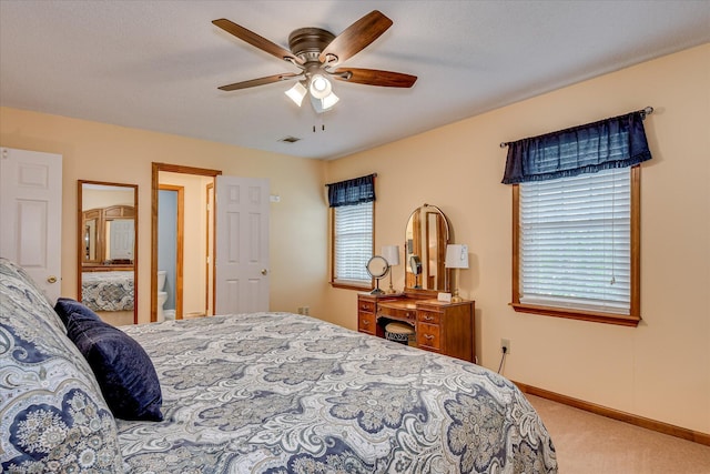bedroom featuring baseboards, multiple windows, carpet flooring, and visible vents
