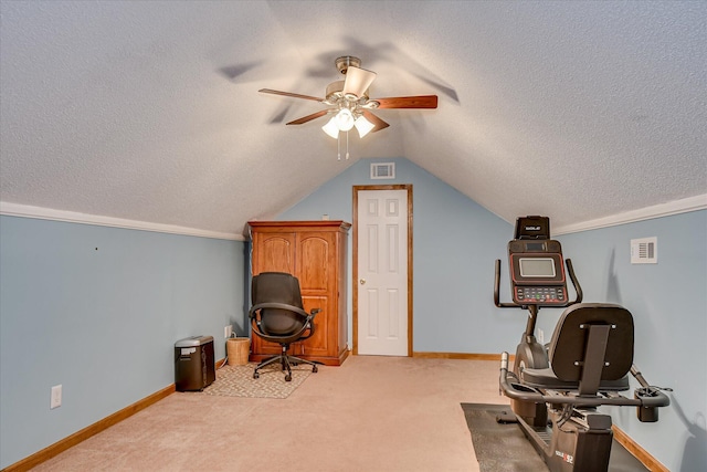 office space with a ceiling fan, carpet floors, a textured ceiling, visible vents, and vaulted ceiling