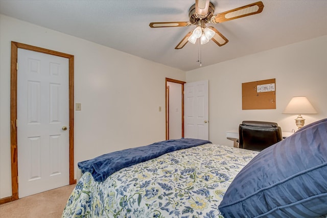 bedroom with light colored carpet and ceiling fan