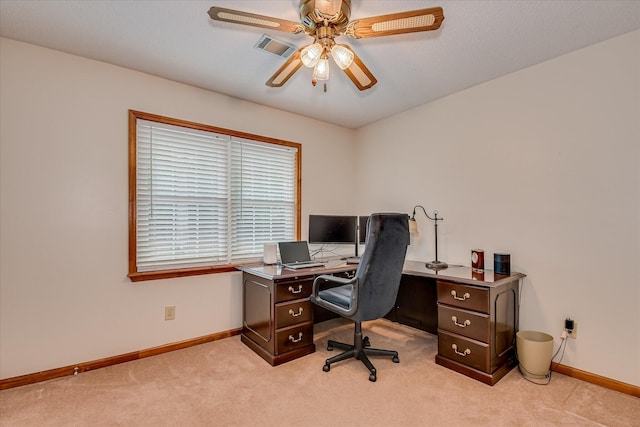 office space featuring ceiling fan, light carpet, baseboards, and visible vents