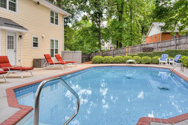 view of pool with a fenced backyard, a patio, and a fenced in pool