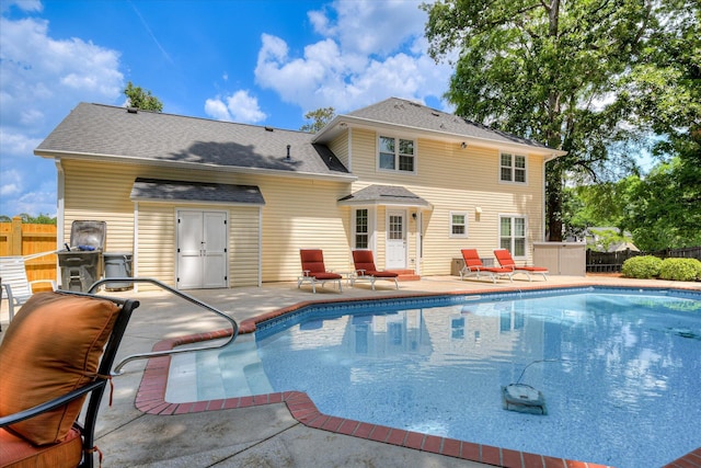 view of swimming pool with fence, a patio, and a fenced in pool