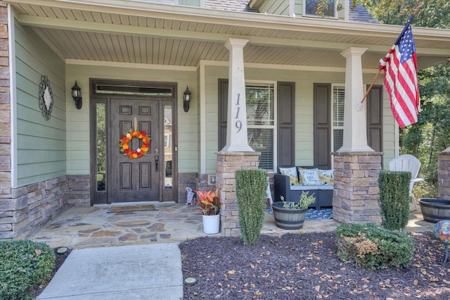 entrance to property with a porch