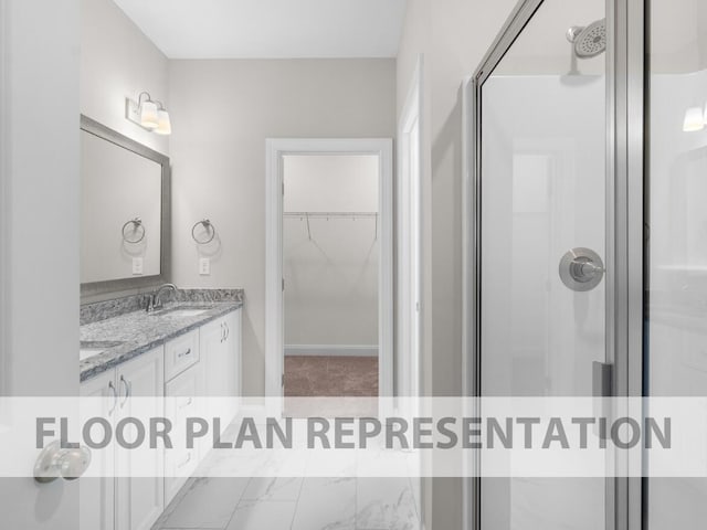 bathroom with a shower with door and vanity