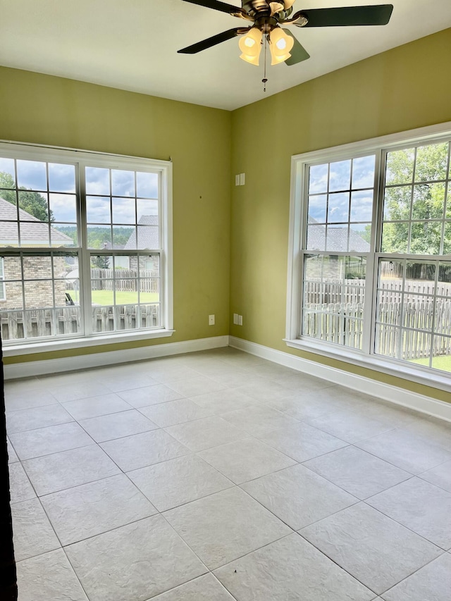 1124 Brighton Dr, Evans, GA 30809 - spare room featuring tile patterned flooring, a ceiling fan, and healthy amount of natural light