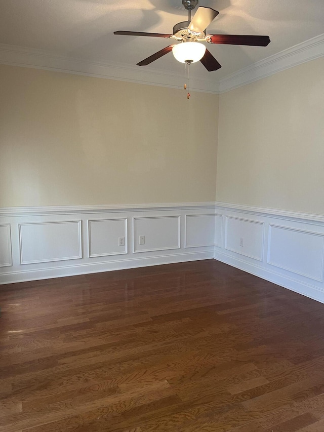 1124 Brighton Dr, Evans, GA 30809 - empty room featuring crown molding, a ceiling fan, dark wood-type flooring, and wainscoting
