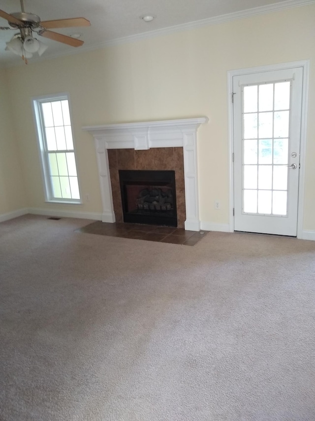 1124 Brighton Dr, Evans, GA 30809 - unfurnished living room with crown molding, a tile fireplace, carpet flooring, and ceiling fan