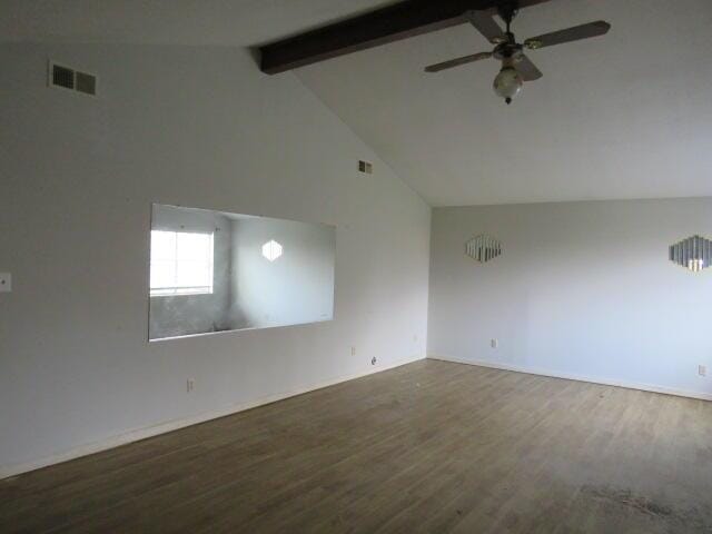 unfurnished room featuring visible vents, wood finished floors, beam ceiling, and a ceiling fan