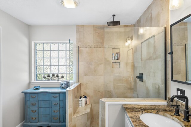 full bathroom with a sink and a walk in shower