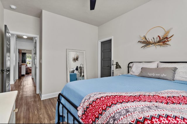 bedroom with ceiling fan and dark hardwood / wood-style floors