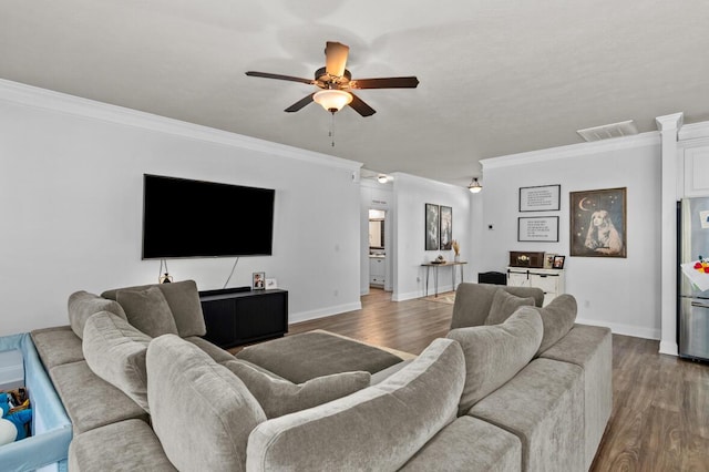 living room with crown molding, ceiling fan, and hardwood / wood-style flooring