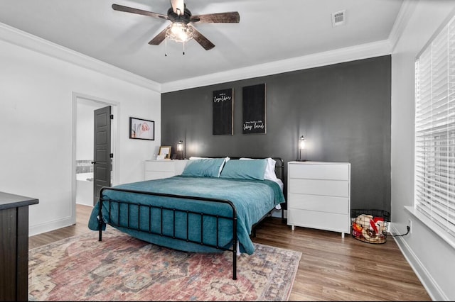 bedroom featuring ensuite bath, ceiling fan, crown molding, and hardwood / wood-style flooring