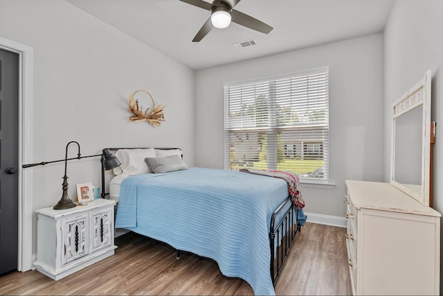 bedroom featuring ceiling fan and hardwood / wood-style flooring