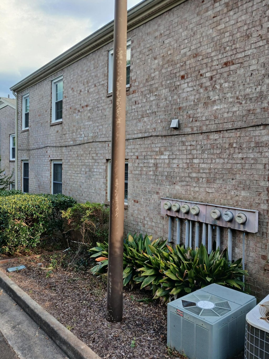 1010 Hickman Rd, Augusta, GA 30904 - view of side of property with a cooling unit and brick siding
