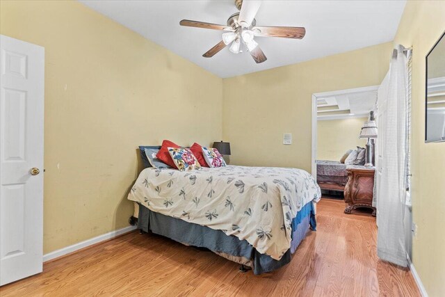 bedroom with hardwood / wood-style flooring and ceiling fan