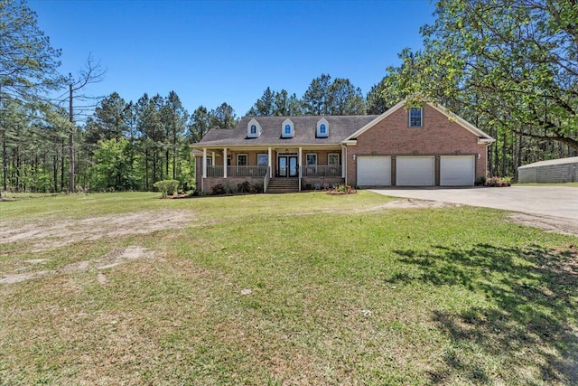 4131 Quaker Rd, Keysville, GA 30816 - cape cod-style house featuring a front lawn, covered porch, and a garage
