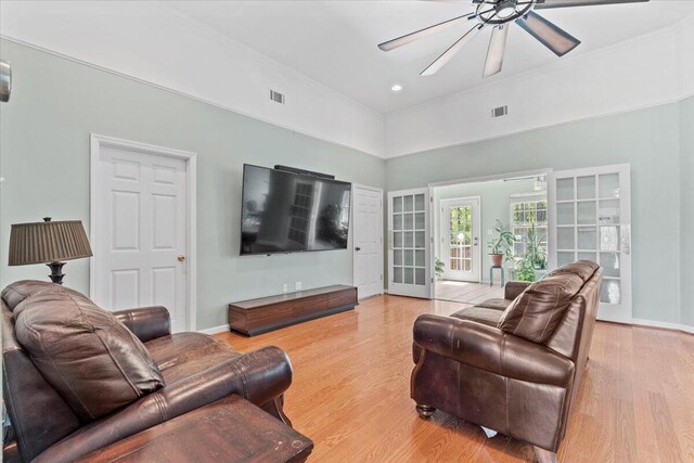 living room featuring french doors, ceiling fan, and hardwood / wood-style floors