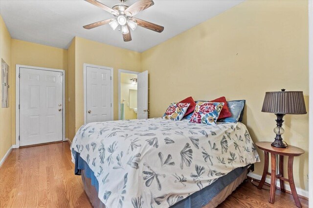 bedroom with hardwood / wood-style floors and ceiling fan