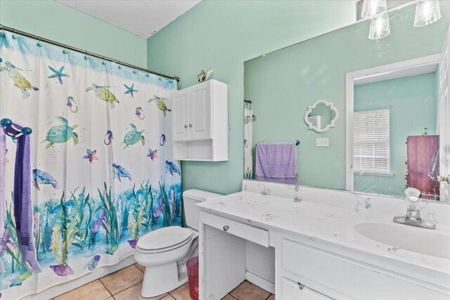 full bathroom with tile patterned flooring, vanity, shower / bath combo, and toilet