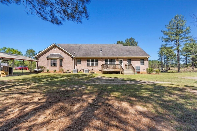 view of front facade with a carport, a deck, a front yard, and central AC