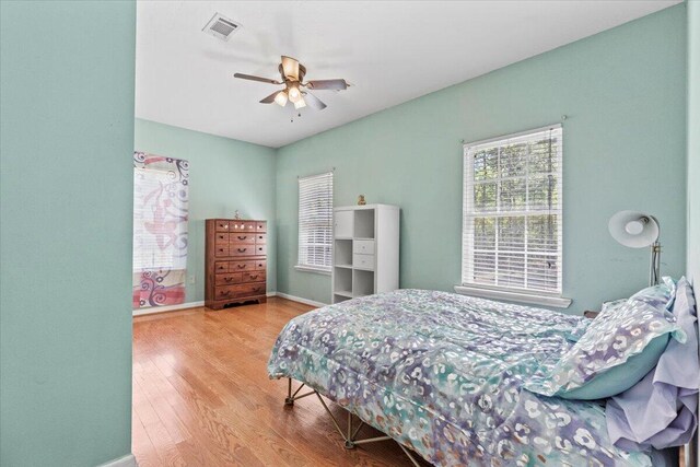 bedroom featuring ceiling fan and light wood-type flooring