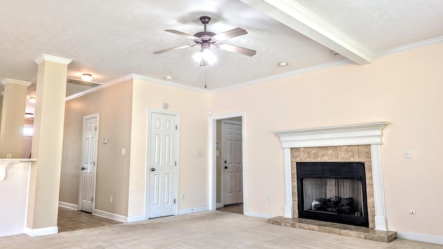627 Surrey Ln, Martinez, GA 30907 - unfurnished living room with baseboards, a tiled fireplace, ornamental molding, ceiling fan, and carpet